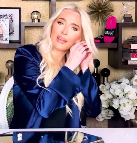 Erika Jayne wears royal blue pajamas.