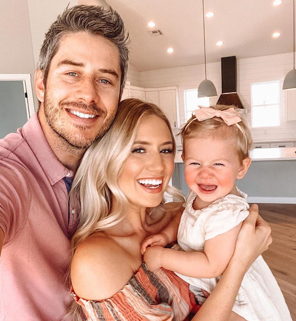 Arie Luyendyk Jr. and Lauren Burnham take a selfie with daughter Alessie