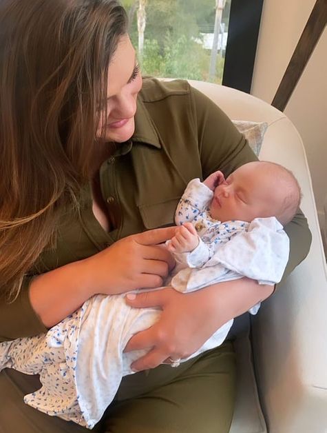 Brittany Cartwright holds Lala Kent's baby girl.