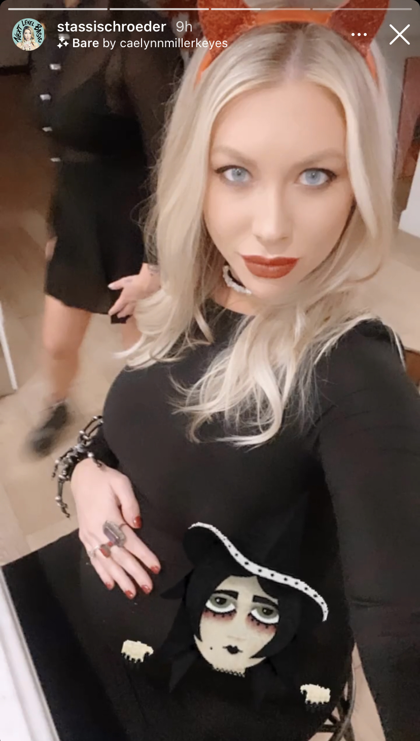 Stassi Schroeder shows off her baby bump while dressed like a witch.