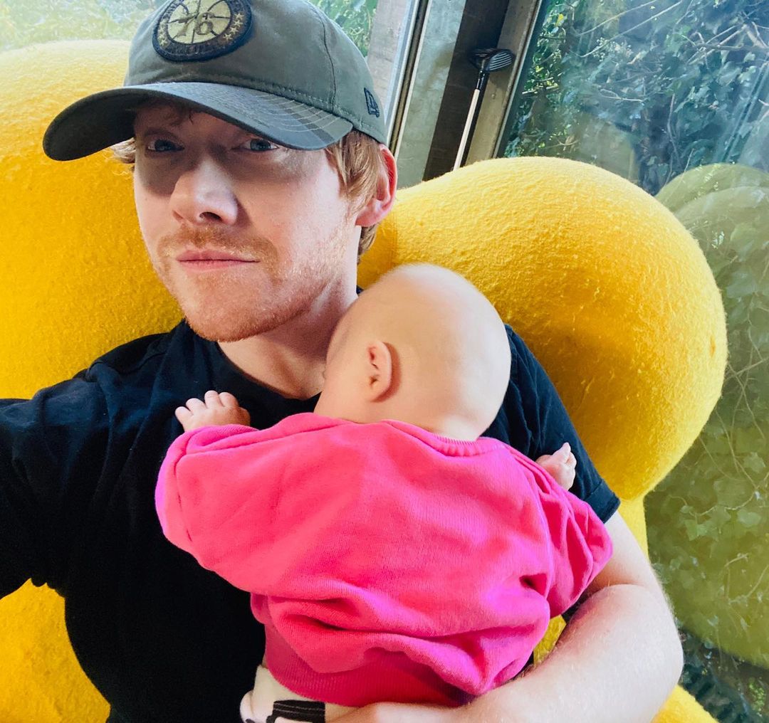 Rupert Grint takes a selfie holding his newborn baby daughter, Wednesday.