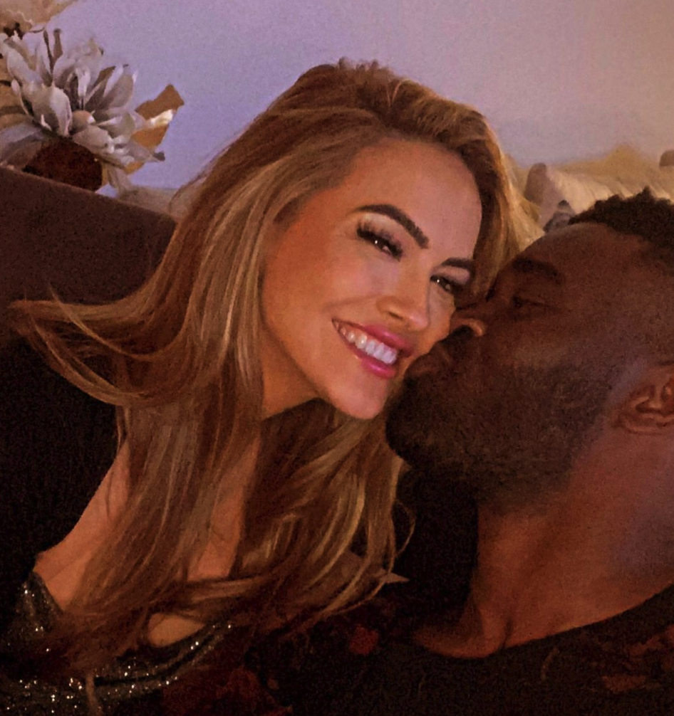 Chrishell Stause gets a kiss from Keo Motsepe.