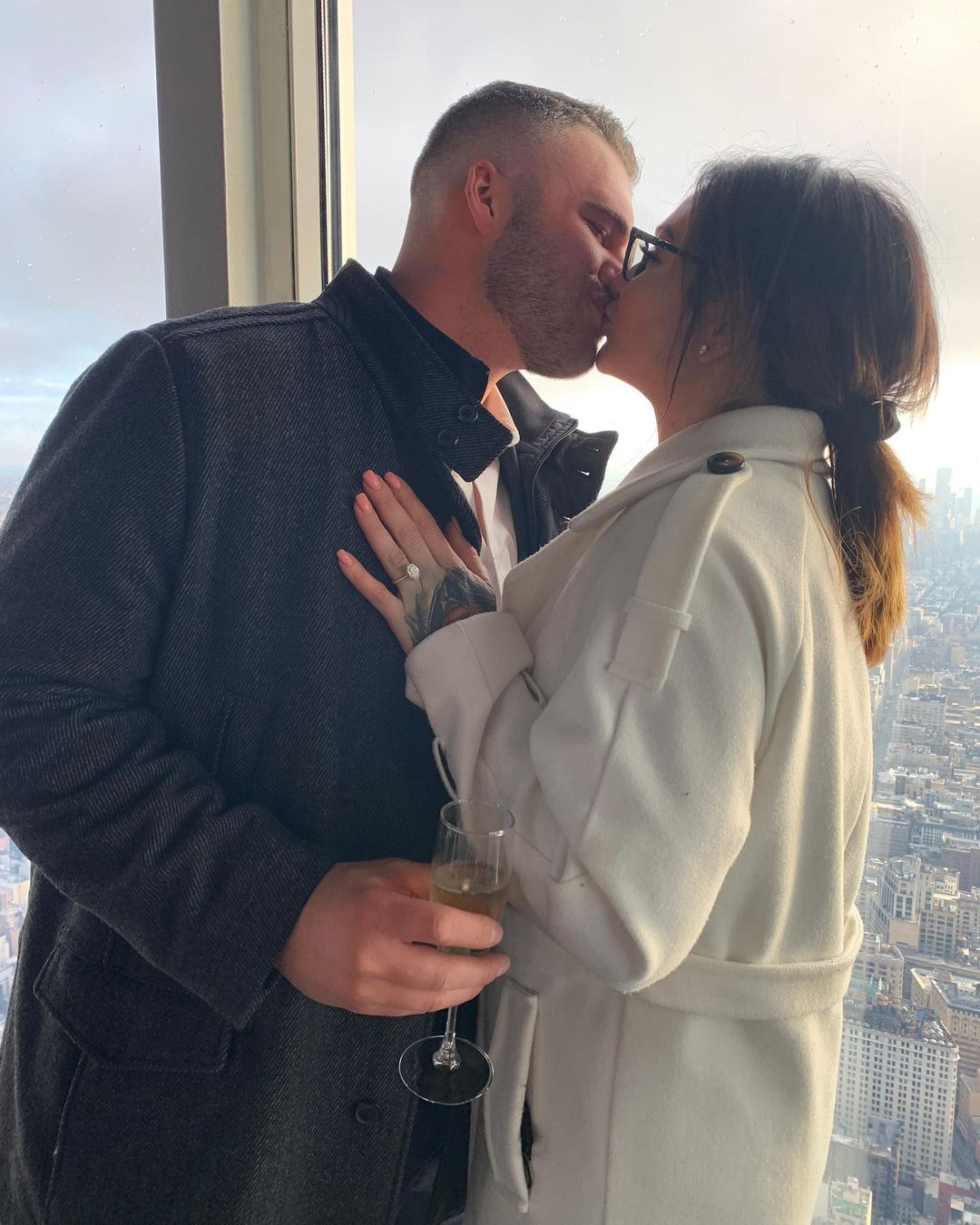 A lovely photo of Jenni JWoww Farley and Zack Carpinello sharing a warm kiss from a high building.