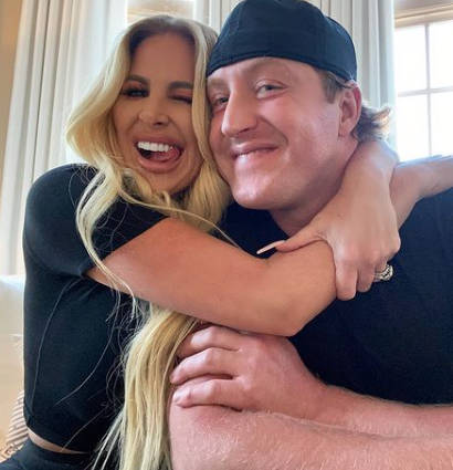 Kim Zolciak sticks out her tongue with Kroy Biermann.