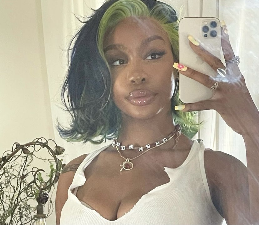 SZA taking a selfie.