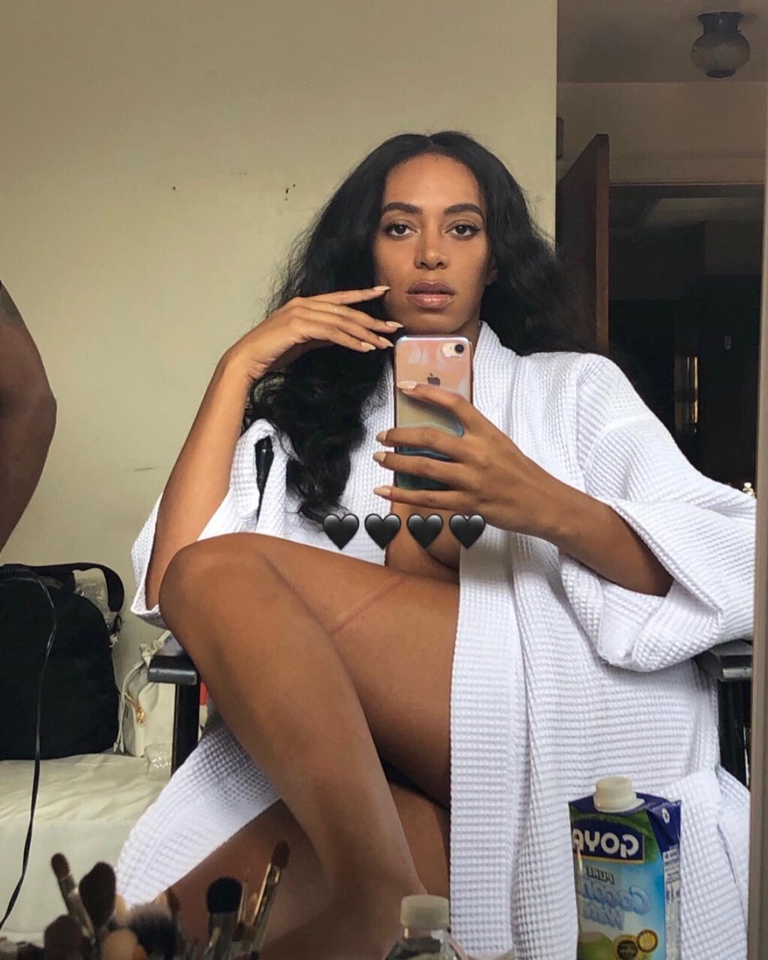 Solange Knowles looks gorgeous in this mirror selfie, showing her in a white robe.