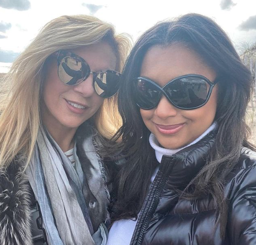 Ramona Singer and Eboni K. Williams pose in winter coats.