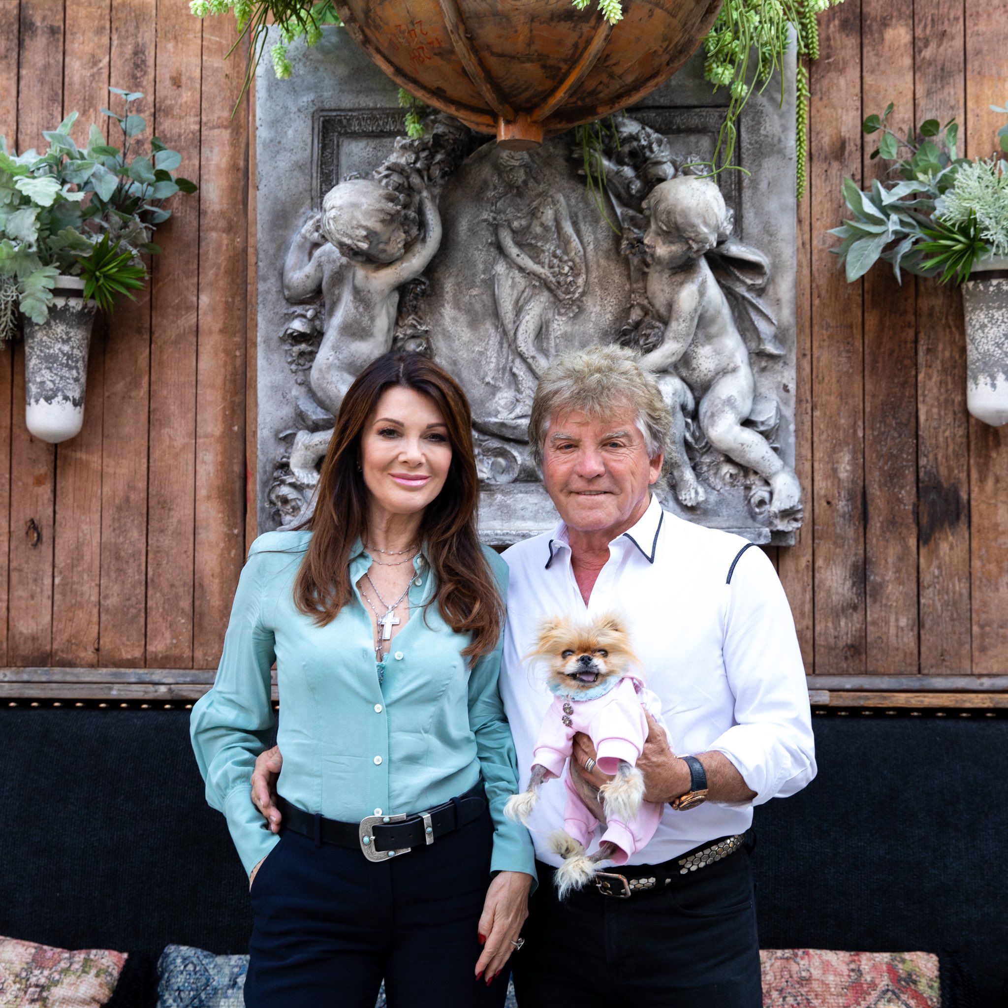 Lisa Vanderpump and Ken Todd smile at TomTom with Giggy.