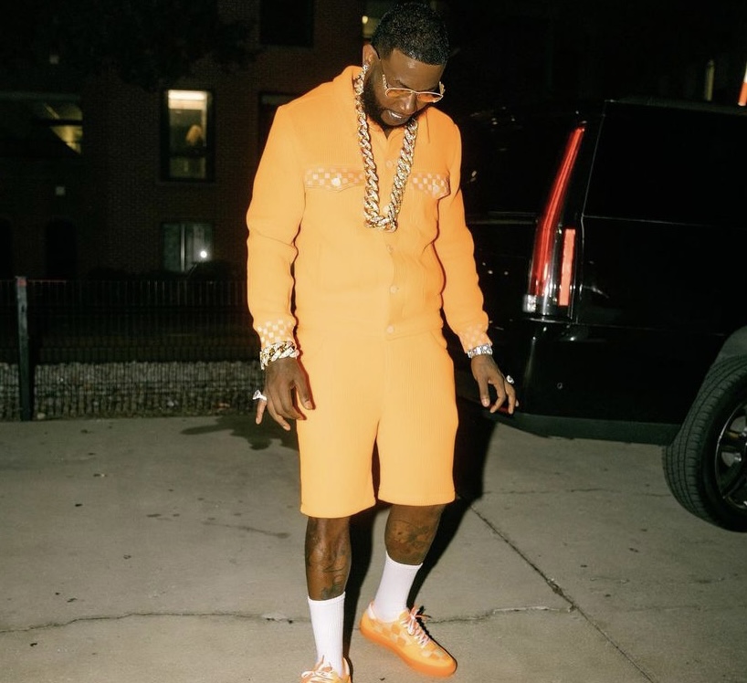 Gucci in his all orange Louis Vuitton outfit.