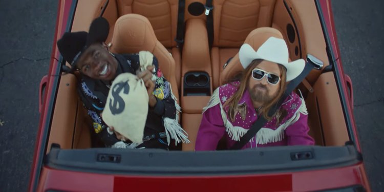 Nas X and Billy Ray crusing around town together.