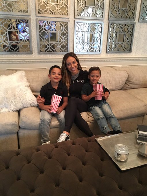 Melissa Gorga eats popcorn with her sons.