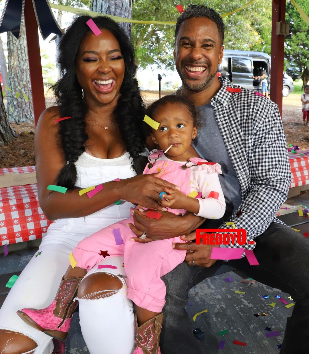 A photo showing a bonding moment between Kenya Moore and her estranged husband, Marc Daly, with their sweet bundle of joy.