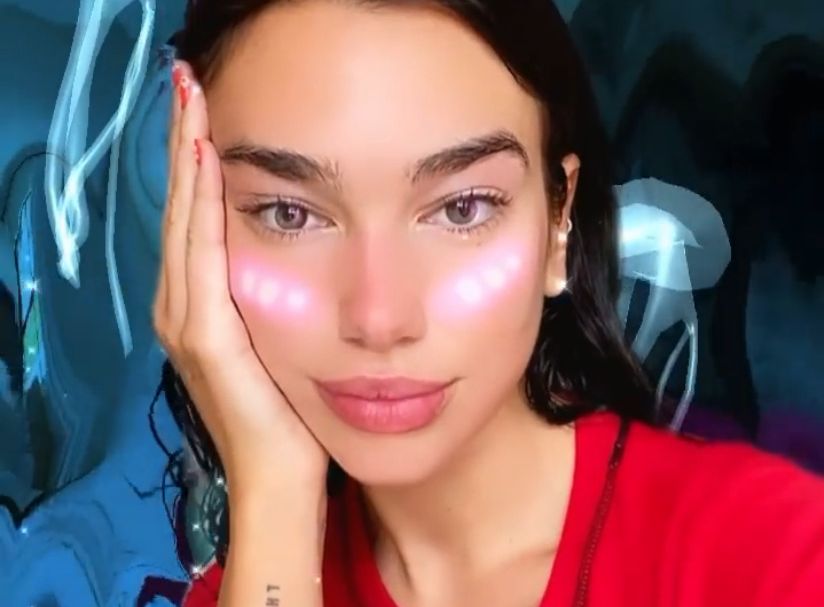 Dua Lipa with red shirt