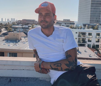 Max Boyens sits in front of the Los Angeles skyline.