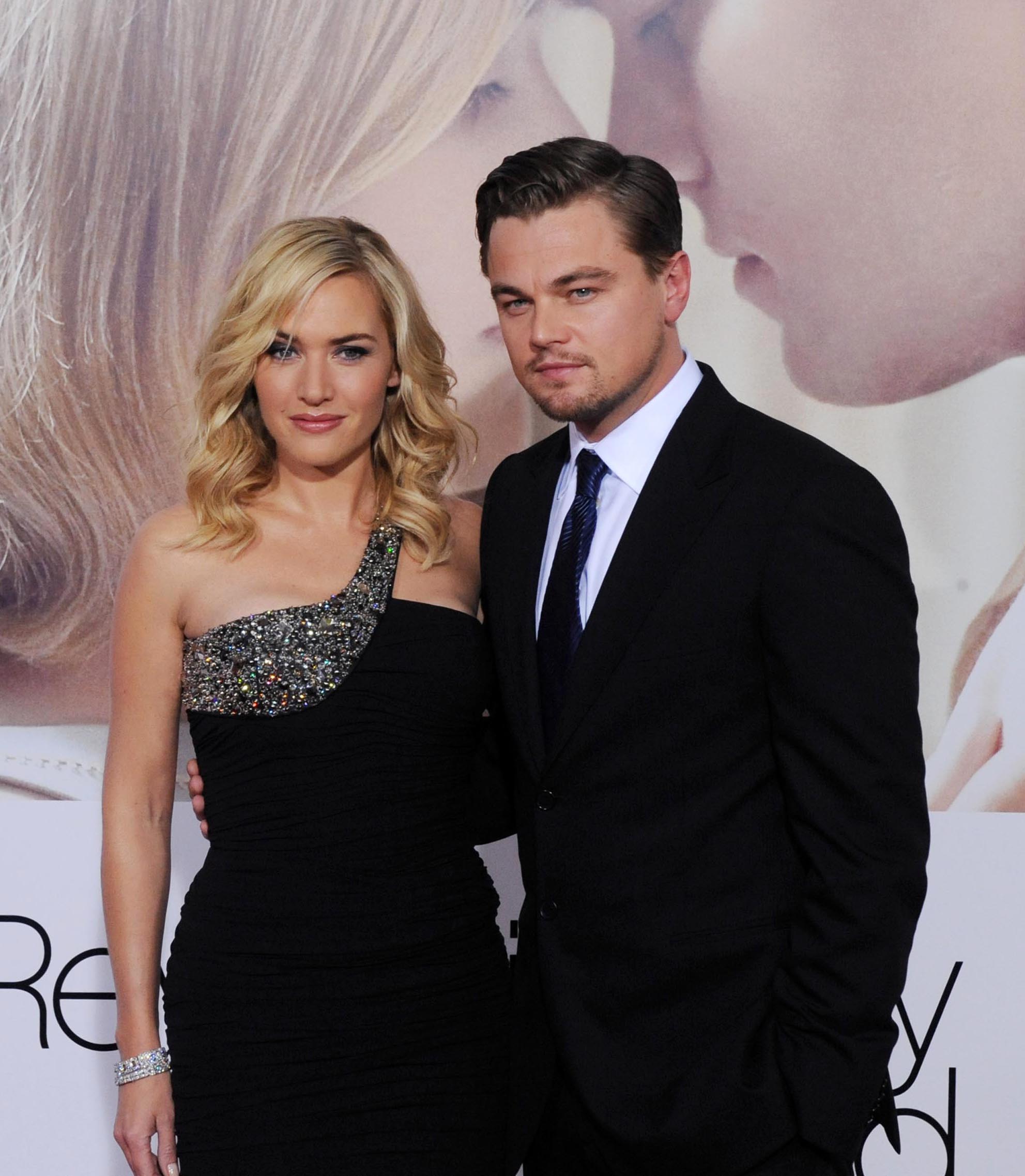 A photo showing Leonardo DiCaprio and Kate Winslet both in black outfits looking good at an event.