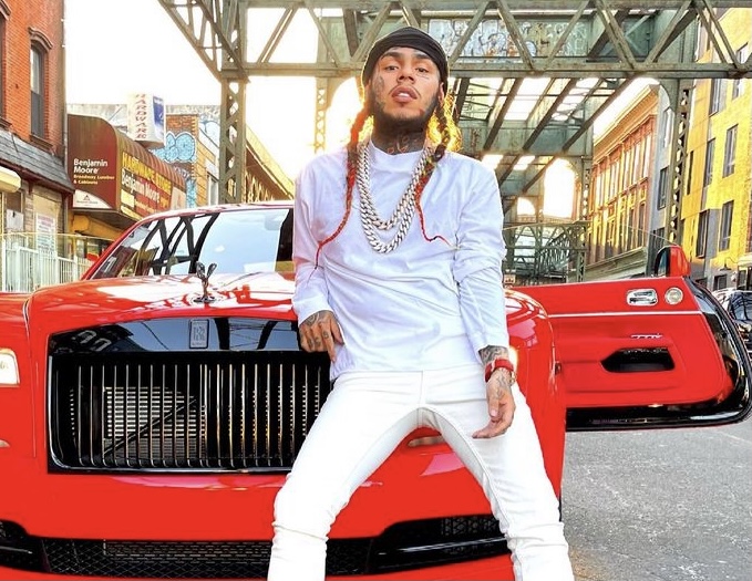 6ix9ine in front of his Rolls Royce.