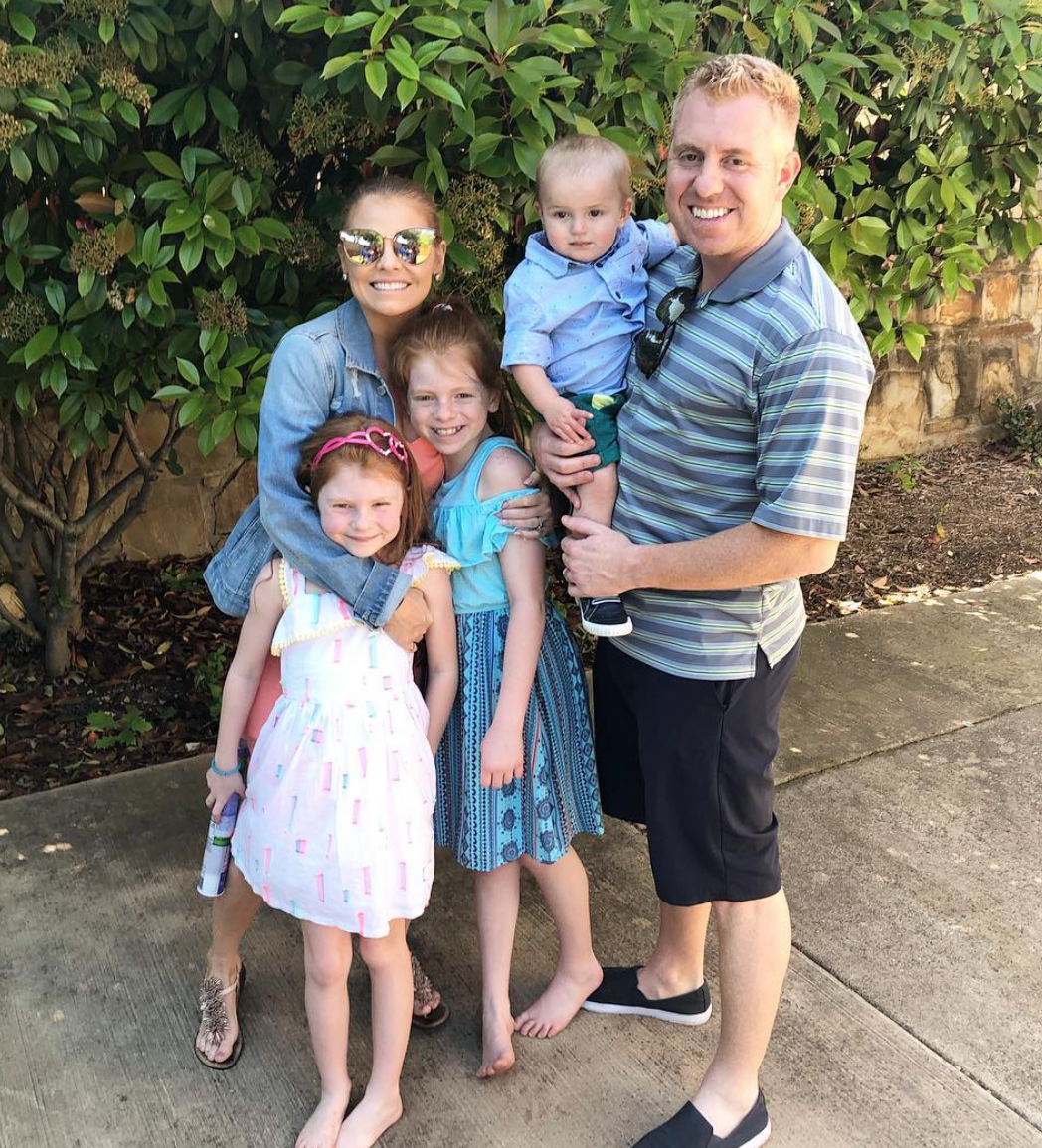 Brandi Redmond and her family dress in matching blue outfits.