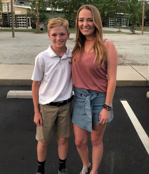 Maci Bookout stands with son Bentley at his school.