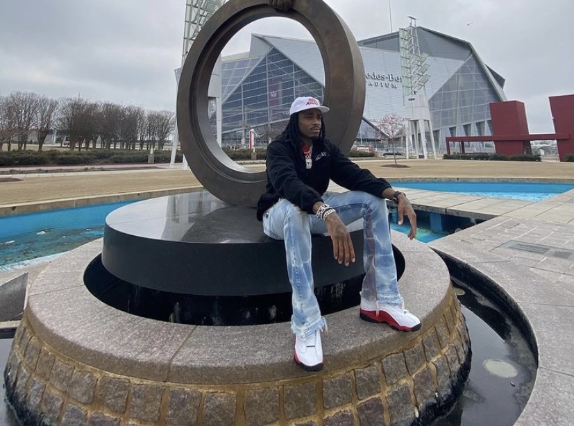 Quavo relaxing by Mercedes-Benz Stadium in Atlanta.