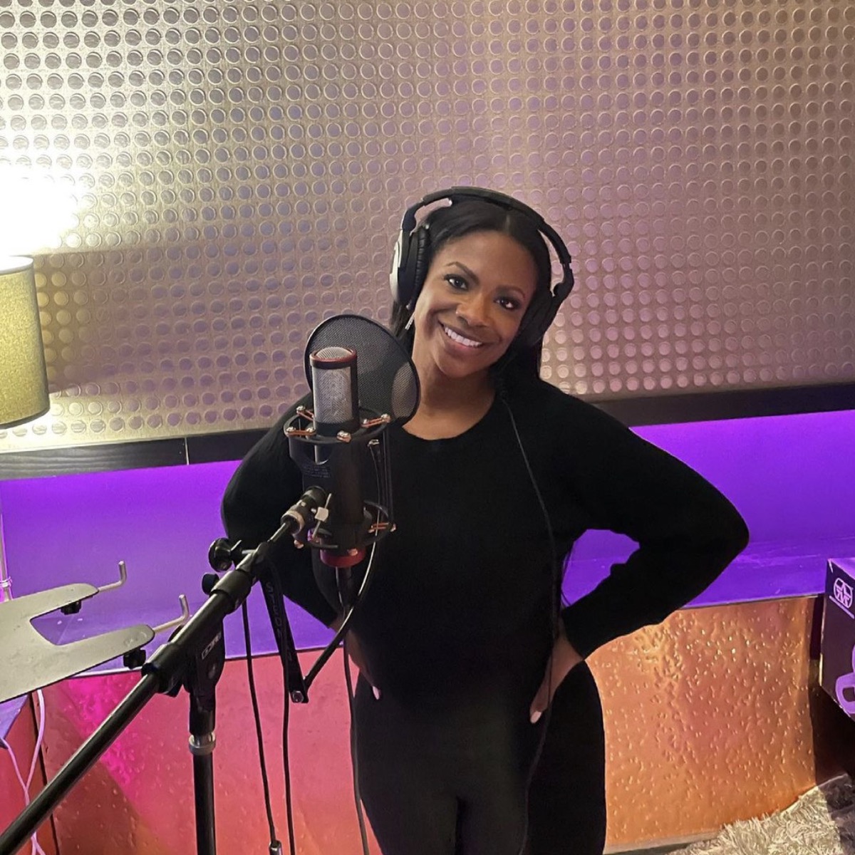 Kandi Burruss wears black in a recording studio.