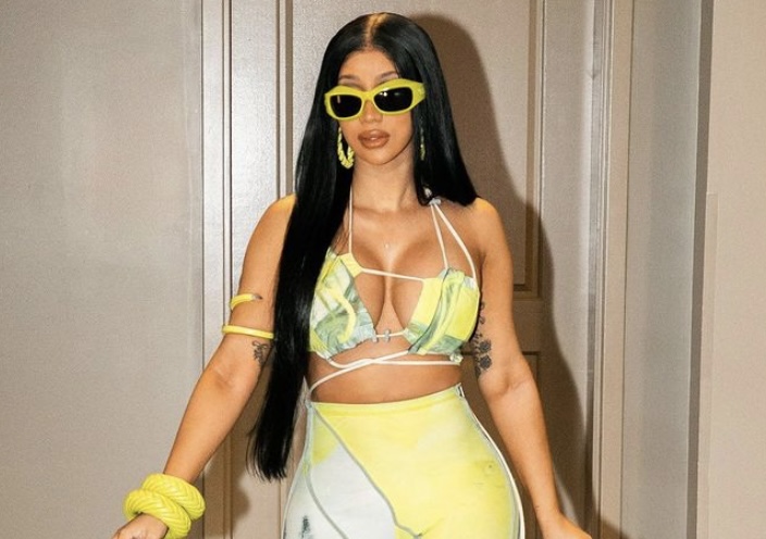 Cardi sporting one of her bright yellow outfits.