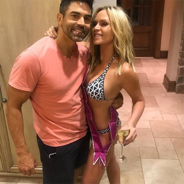 Tamra Judge wears a bikini and hugs Eddie Judge.