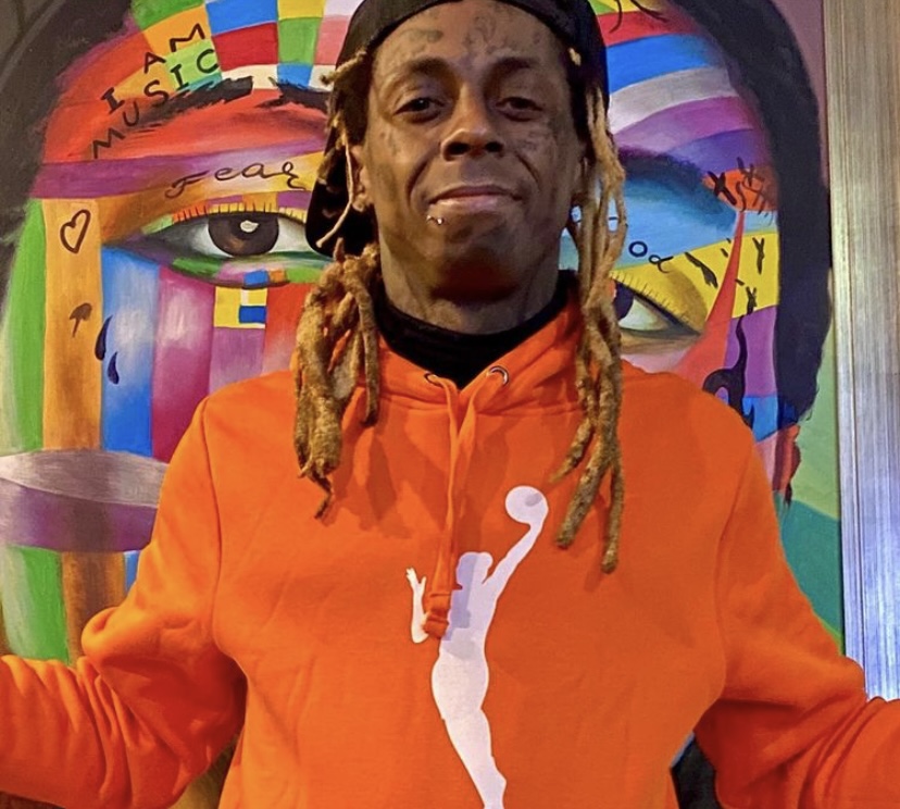 Lil Wayne sporting a WNBA hoodie.