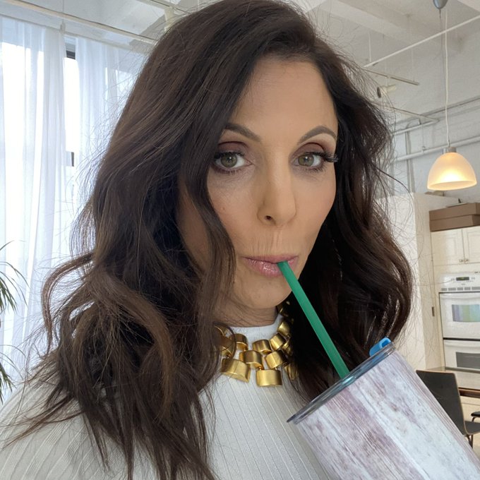 Bethenny Frankel sips a straw.