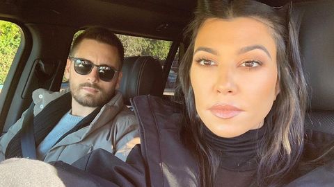 Scott Disick and Kourtney Kardashian taking a selfie in a car