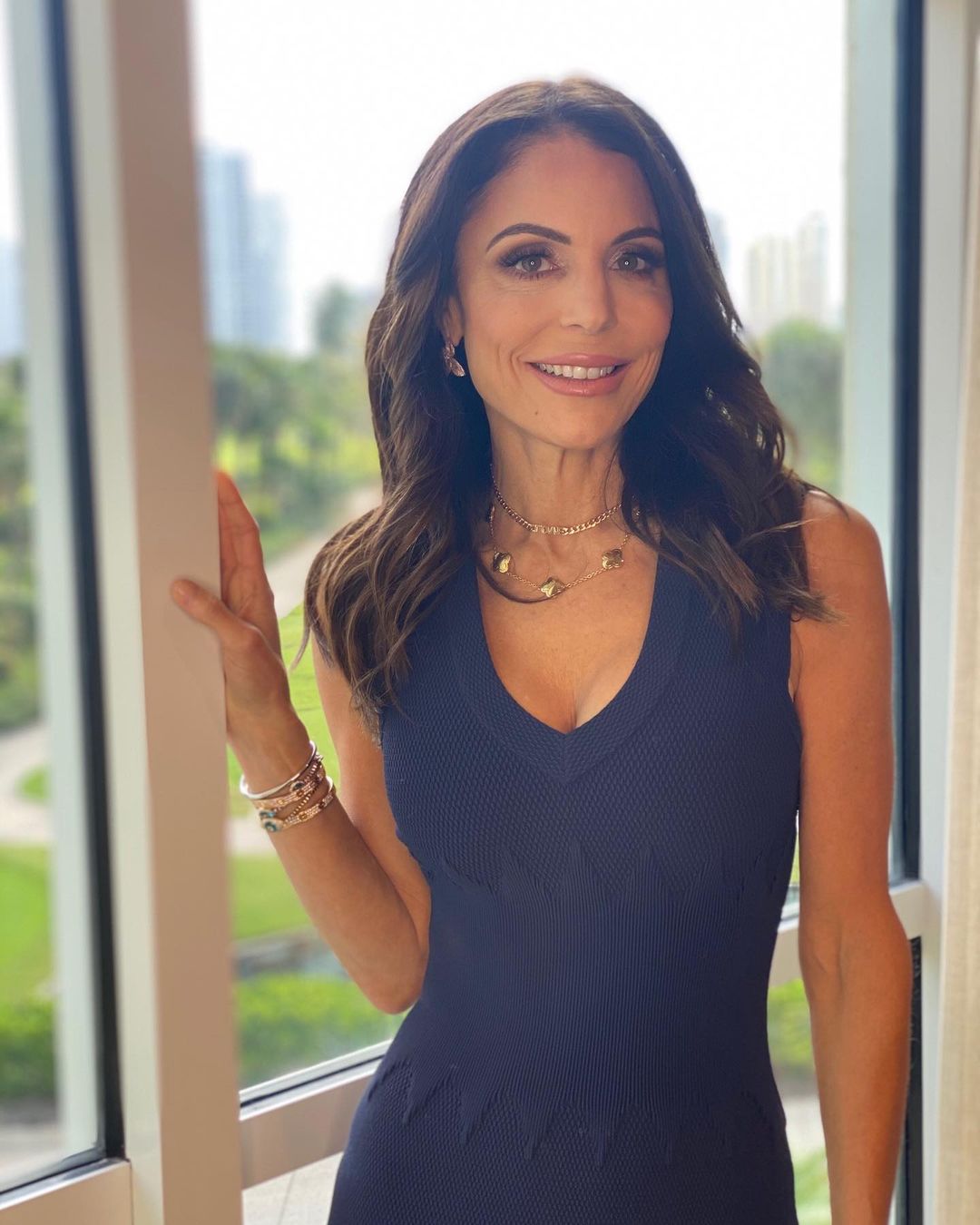 A photo showing Bethenny Frankel in a black fitted dress and she looks amazing.