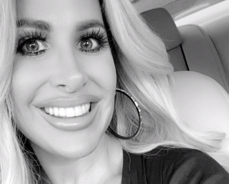 Kim Zolciak takes a black and white selfie.