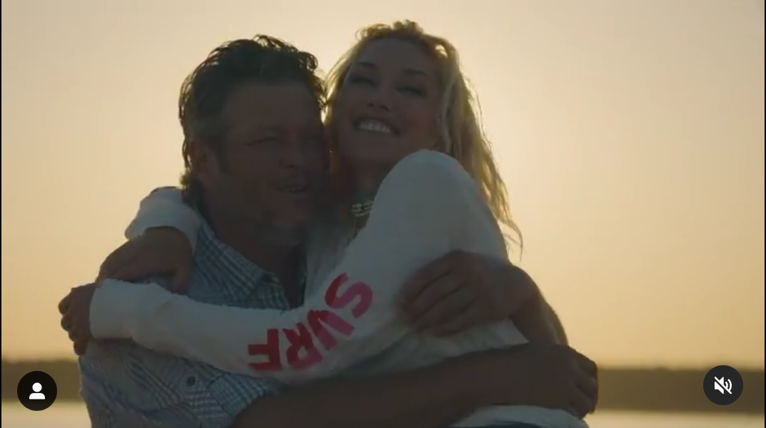 Blake Shelton and Gwen Stefani embracing