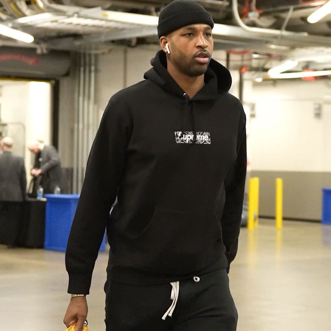 A photo showing Tristan Thompson in a black hoodie, pant and beanie.