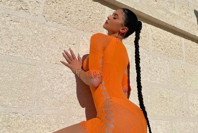 Kylie Jenner with orange outfit