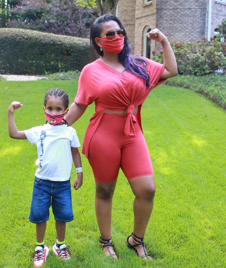 Kandi Burruss wears a red outfit and matching mask.