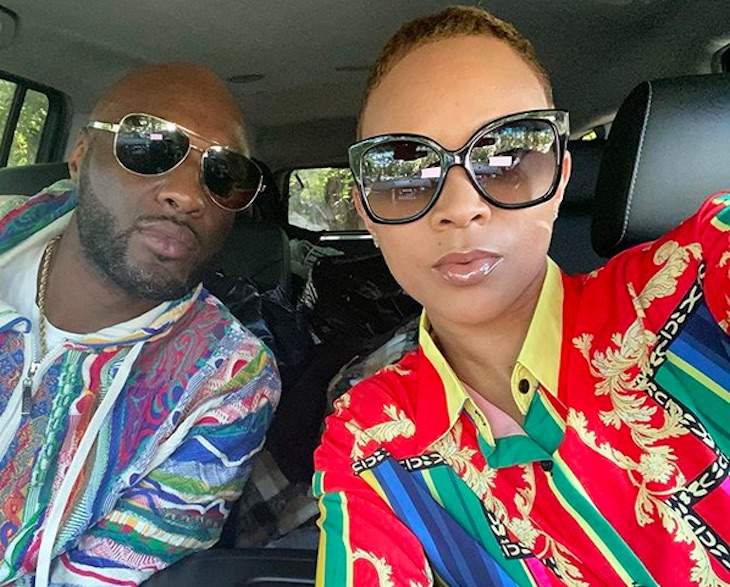 Lamar and Sabrina taking a selfie in a car