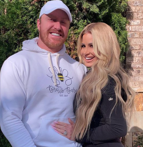 Kim Zolciak poses with her husband Kroy Biermann at their Atlanta home.