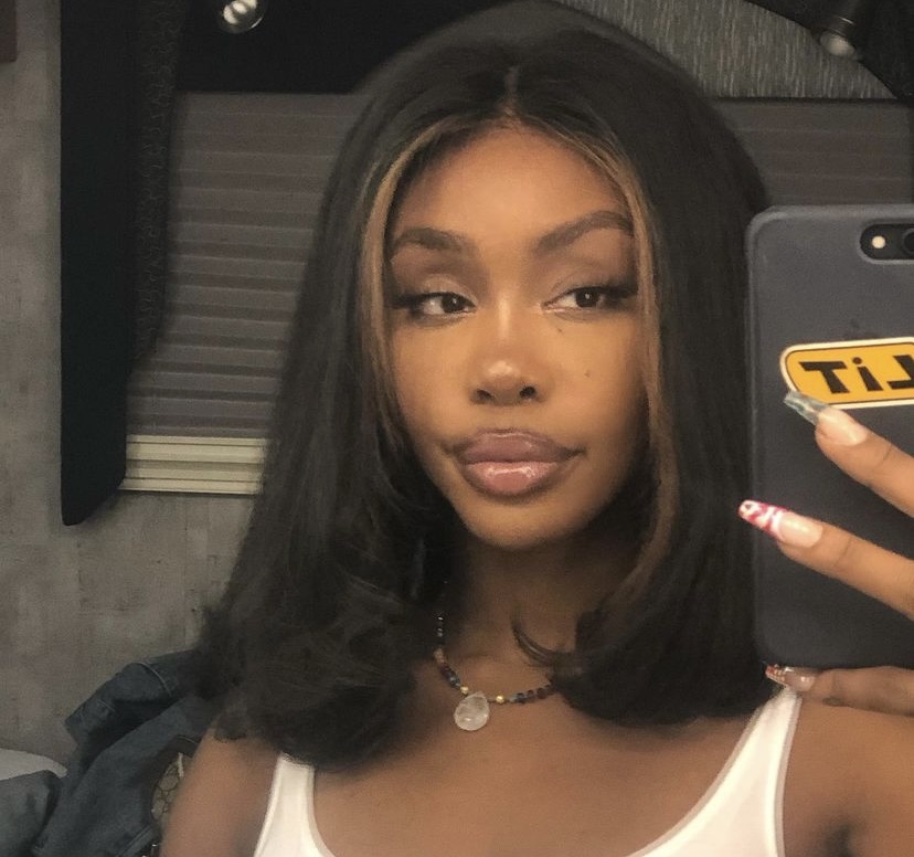 SZA taking a selfie.