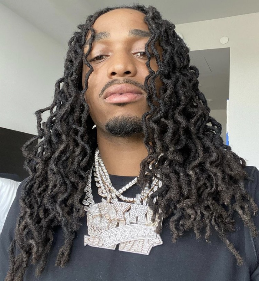 Quavo showing off his jewelry.