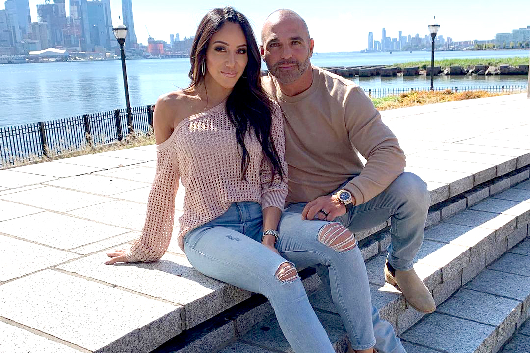 Melissa Gorga wears a pink sweater.