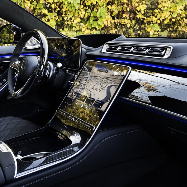 The luxurious interior of the 2026 Mercedes-Benz S-Class, featuring the expansive MBUX Hyperscreen.