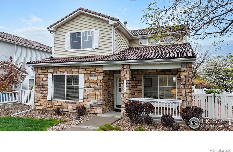 A well-maintained single-family home with a landscaped front yard and brick exterior in Westminster, CO.