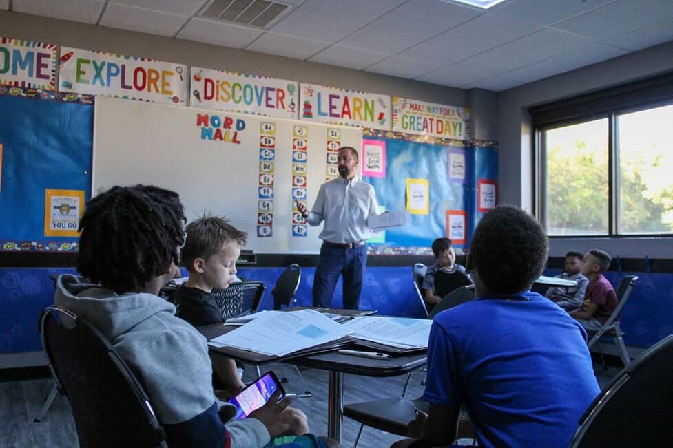 students classroom financial discussion