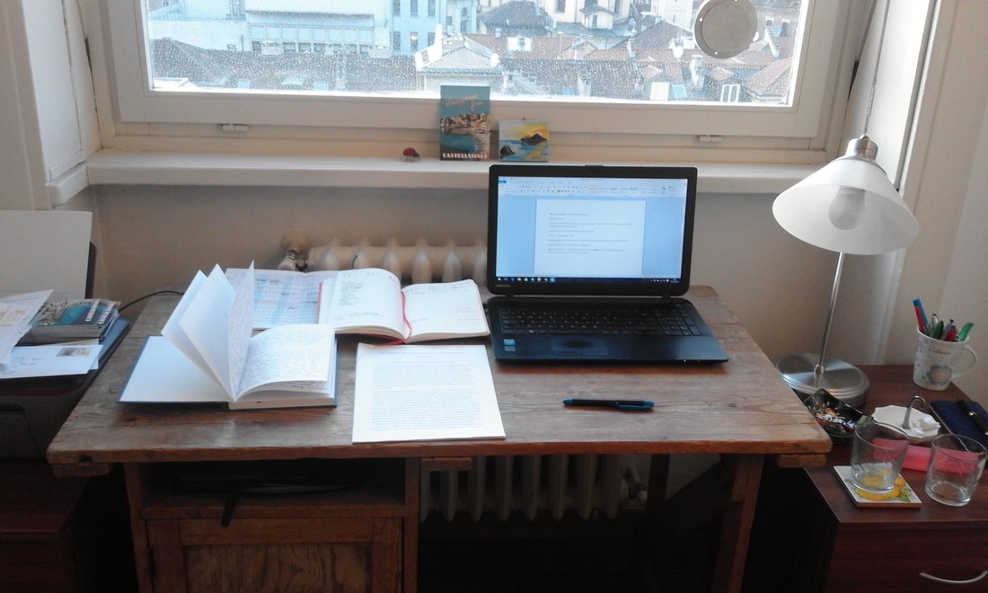research desk with books and computer