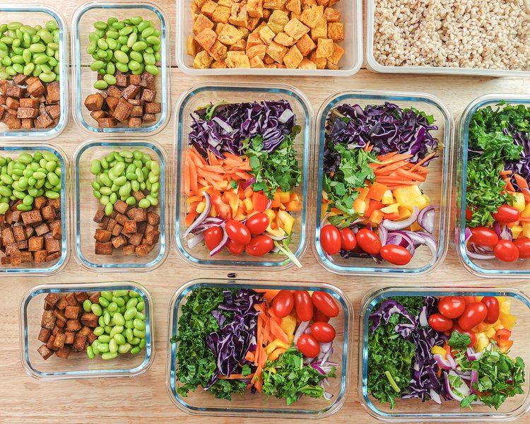 A vibrant vegan salad prepped in a container