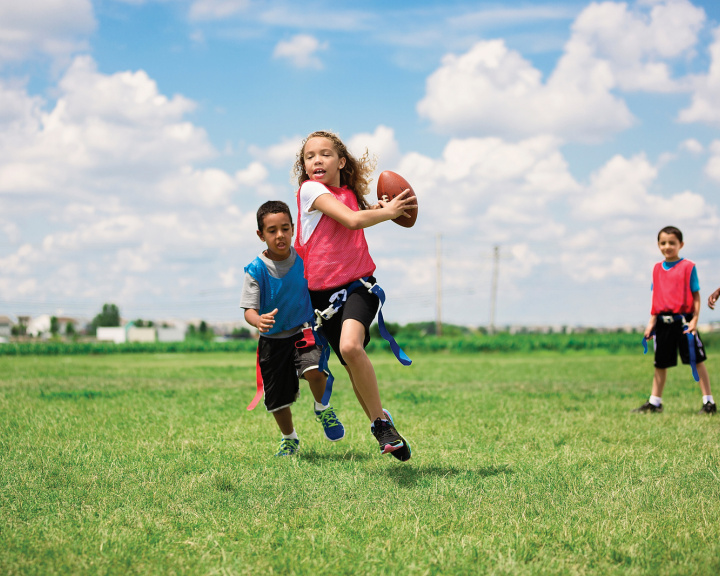 adolescents playing sports outdoors