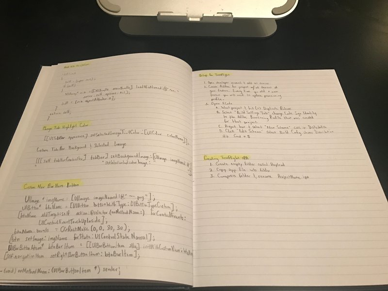 Handwritten programming notes on a tablet
