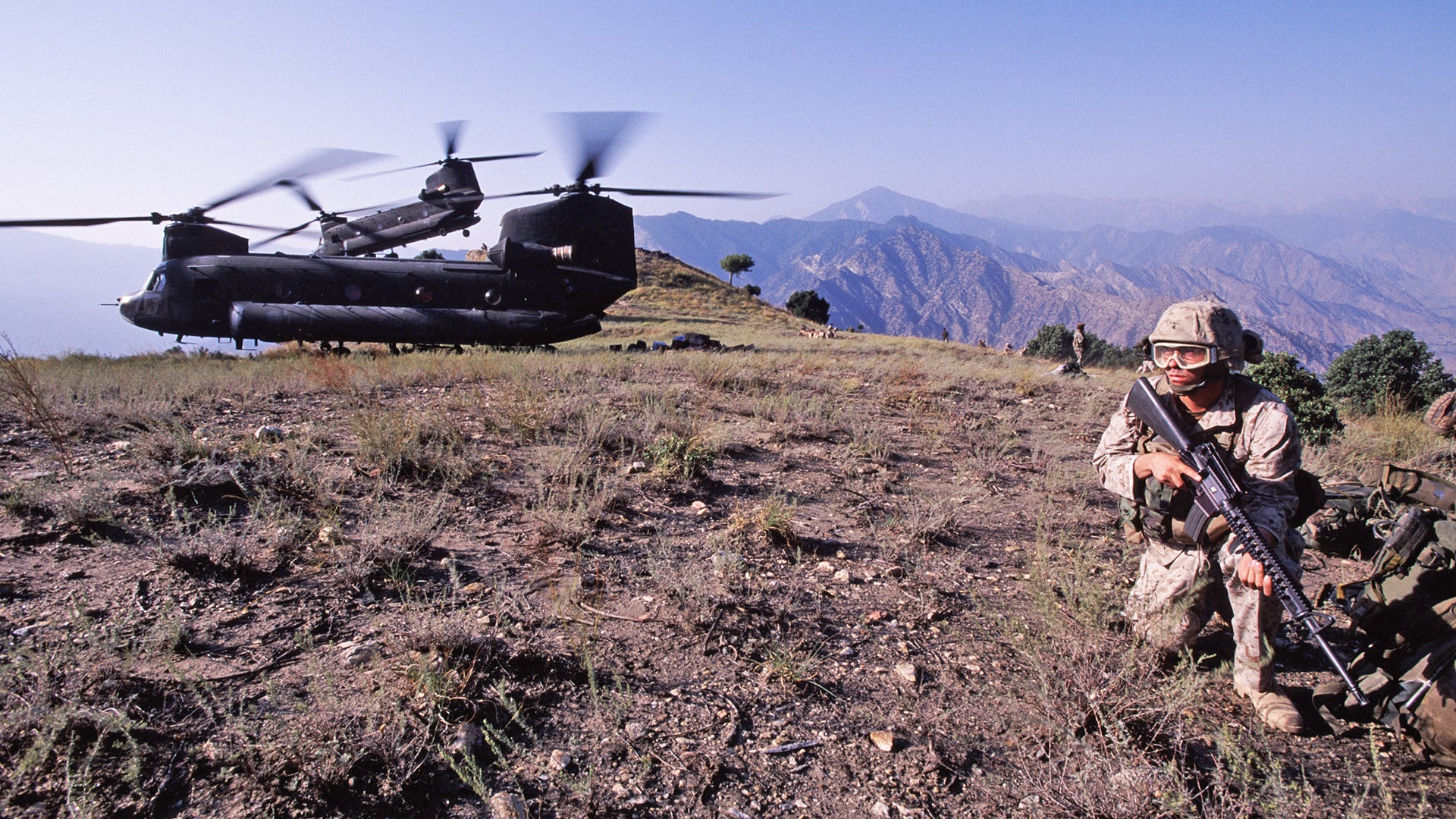 mountainous afghan landscape and strategic military equipment