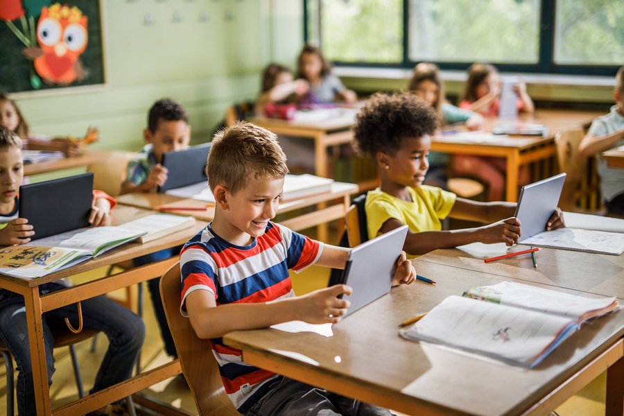 Kids using tablets in a classroom setting