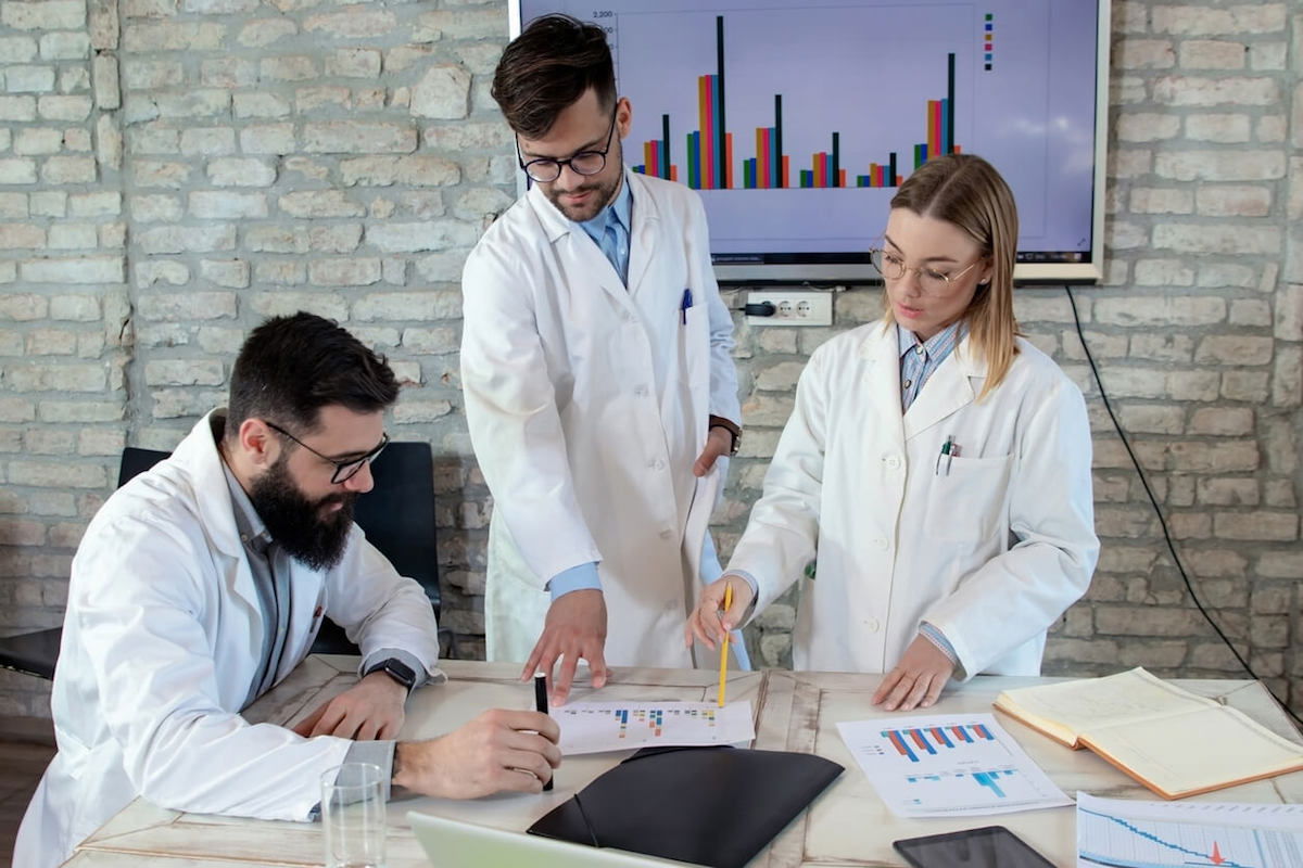 researchers discussing data in laboratory